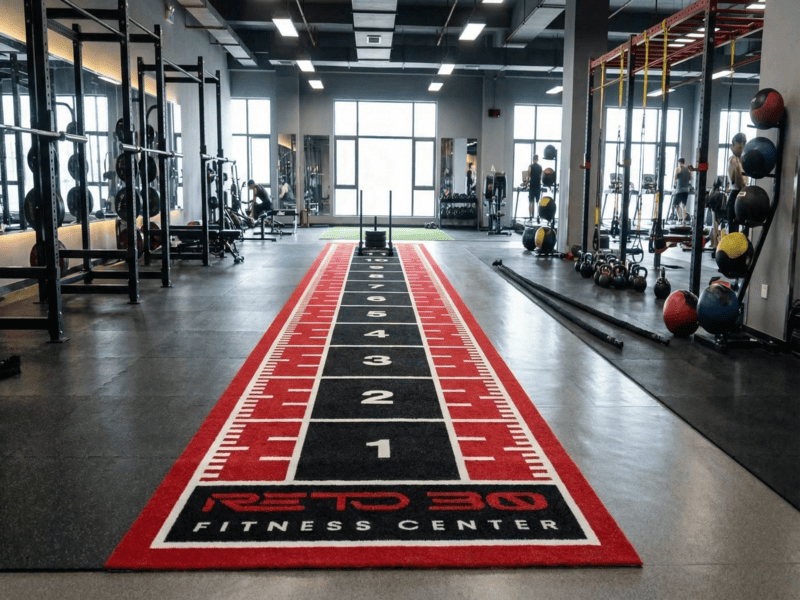 Comparison of two gym turf samples showing different stitch rates and row spacing